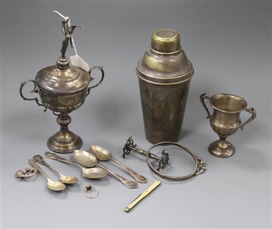Two silver trophy cups, five silver teaspoons, a silver frame mount, a silver Celtic style brooch and four other items.